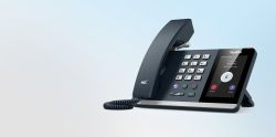 Yealink MP54 E2 Teams IP desk phone angled view with handset, keypad and 4 inch touch screen